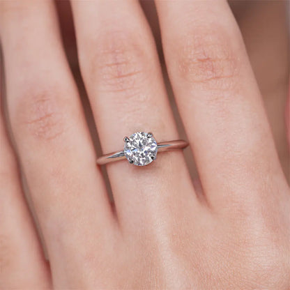 3 carat moissanite solitaire ring worn on a finger